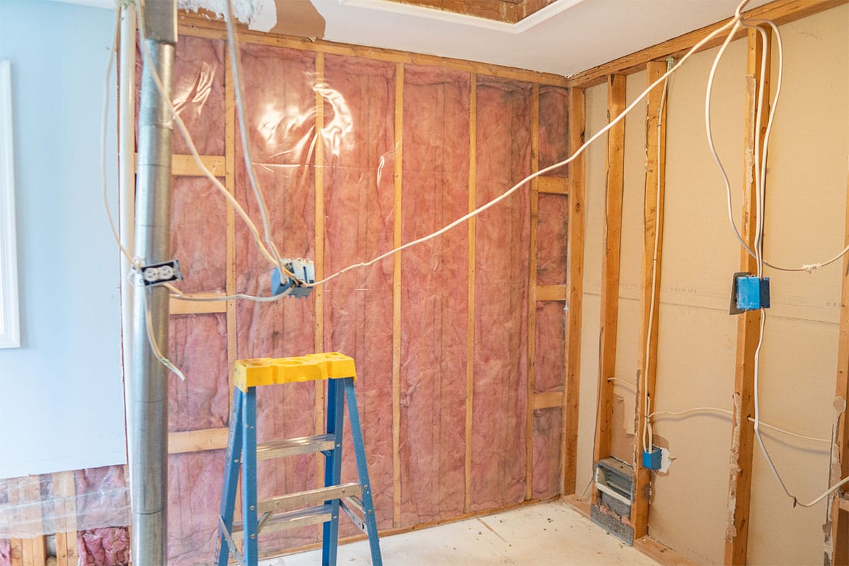Walk-in closet framing and insulation installed ready for new cabinets to be installed