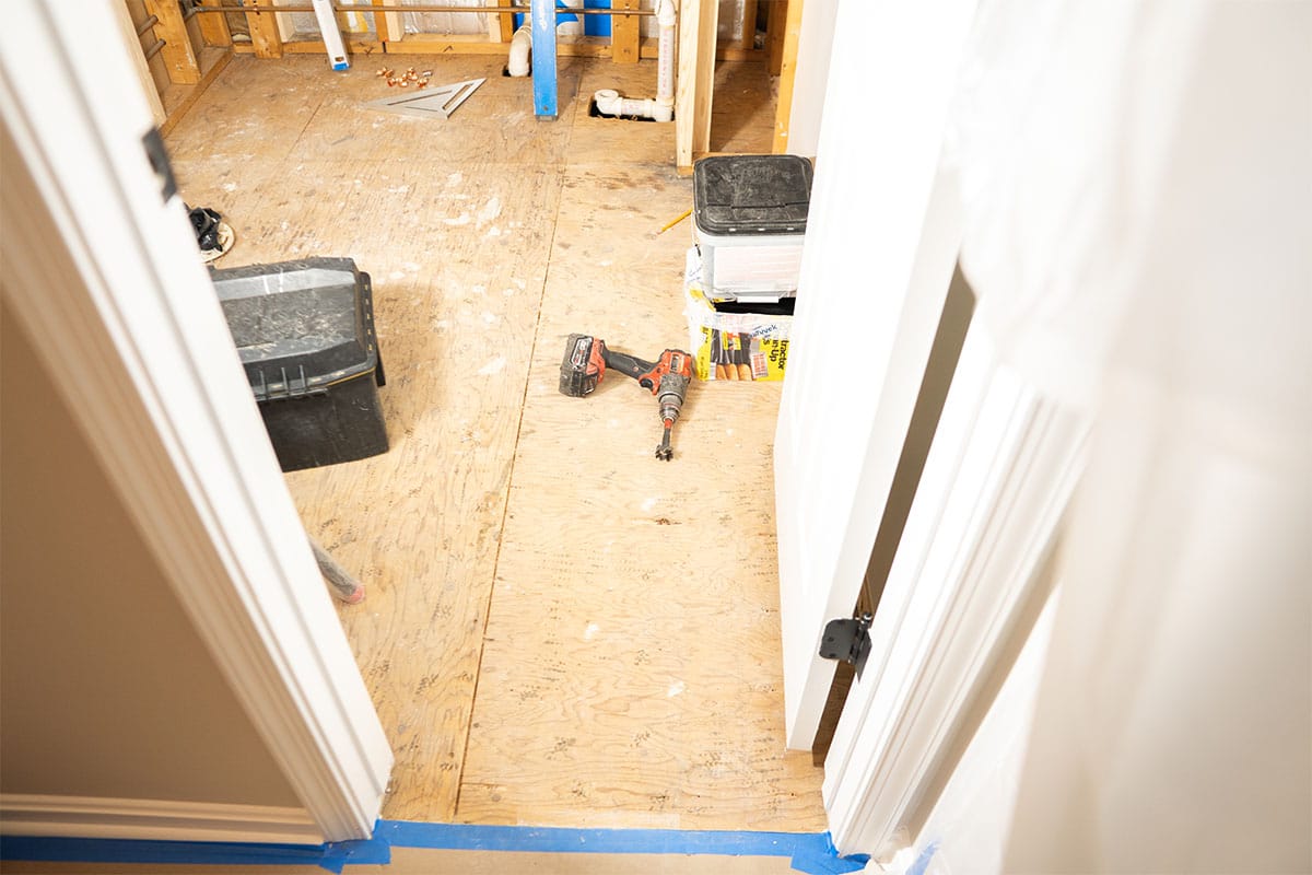 Hallway bathroom flooring completely removed for a renovation