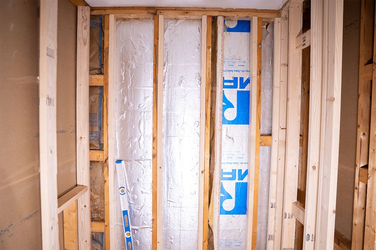 Shower walls of a hallway bathroom gutted down for a renovation